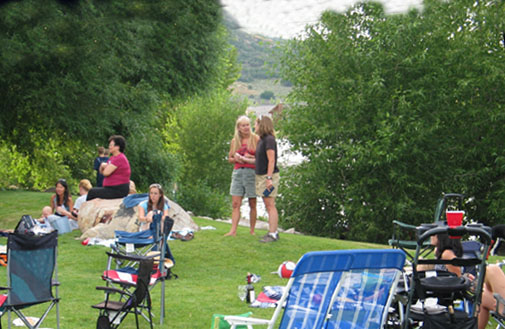 Neighbors enjoy food, shade and music